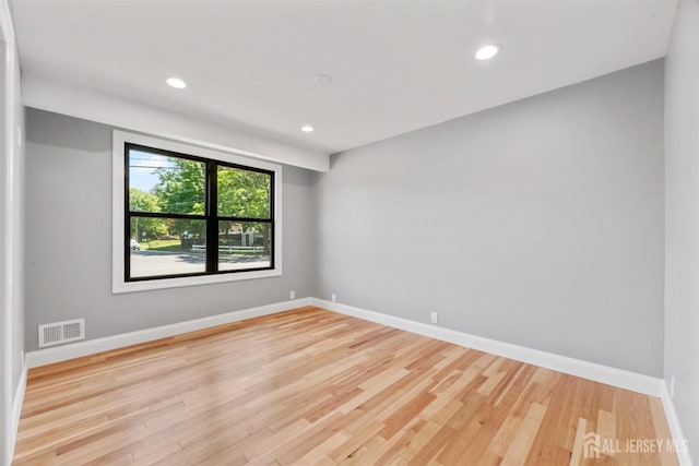 13 Lauretta Dr, East Brunswick, NJ 08816 - empty room with wood finished floors and recessed lighting