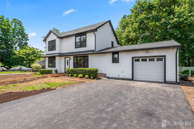 13 Lauretta Dr, East Brunswick, NJ 08816 - view of front of house with an attached garage and driveway