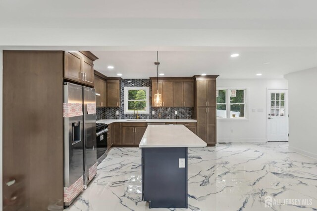 244 Lloyd Rd, Matawan, NJ 07747 - kitchen with appliances with stainless steel finishes, a sink, tasteful backsplash, light countertops, and baseboards