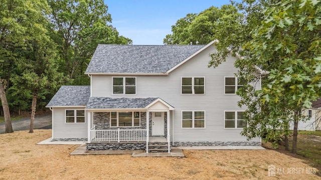 244 Lloyd Rd, Matawan, NJ 07747 - traditional-style house with a porch and a shingled roof