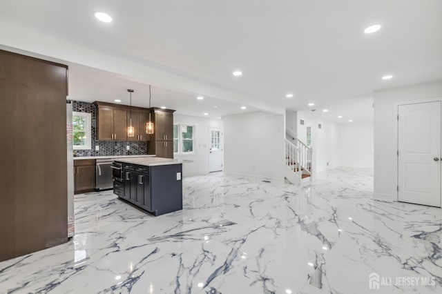244 Lloyd Rd, Matawan, NJ 07747 - kitchen featuring recessed lighting, stainless steel dishwasher, light countertops, open floor plan, and backsplash