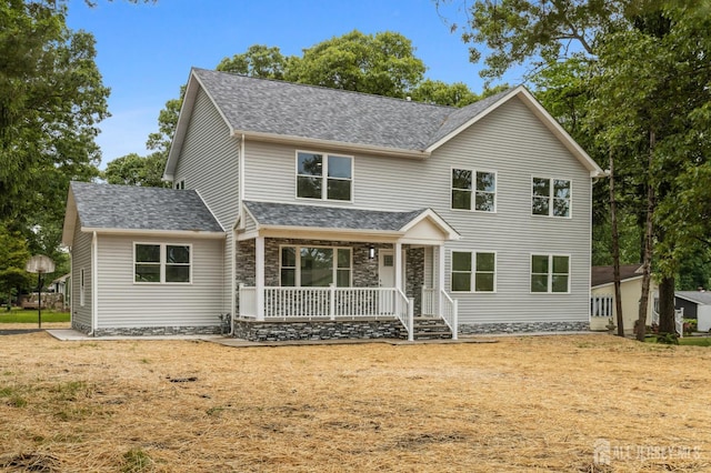 244 Lloyd Rd, Matawan, NJ 07747 - traditional-style house with covered porch, roof with shingles, and stone siding