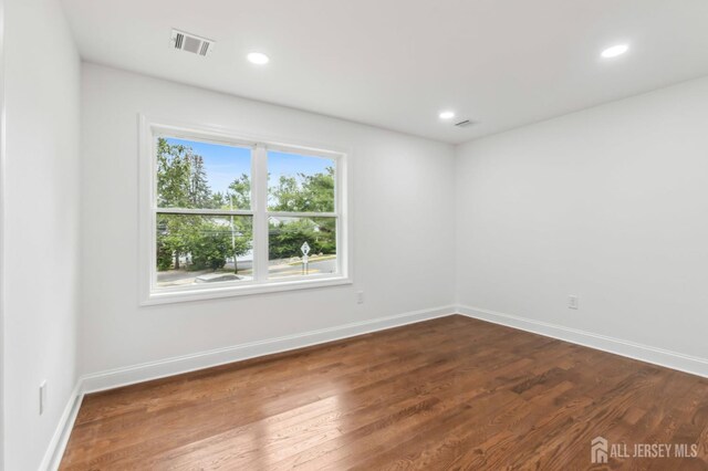 244 Lloyd Rd, Matawan, NJ 07747 - empty room with dark wood finished floors, recessed lighting, and baseboards