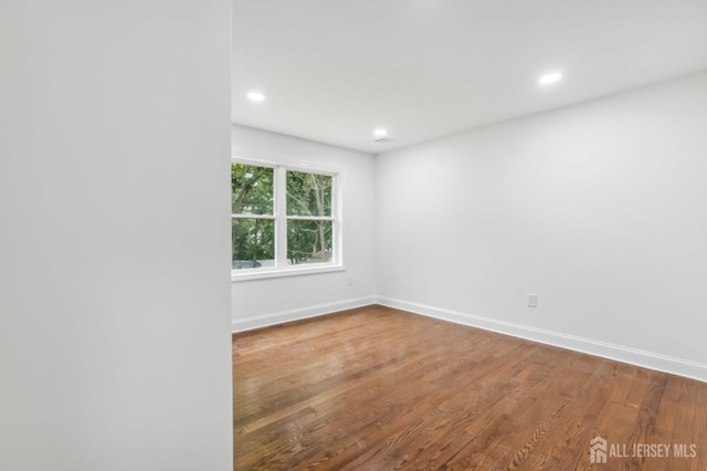 244 Lloyd Rd, Matawan, NJ 07747 - spare room with baseboards, wood finished floors, and recessed lighting