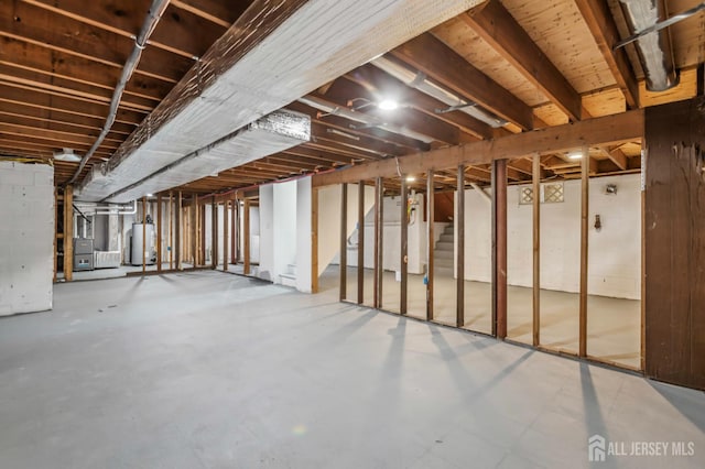 244 Lloyd Rd, Matawan, NJ 07747 - unfinished below grade area with water heater, stairway, and heating unit