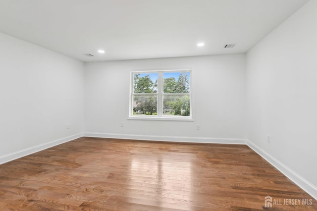 244 Lloyd Rd, Matawan, NJ 07747 - spare room featuring wood finished floors, baseboards, and recessed lighting