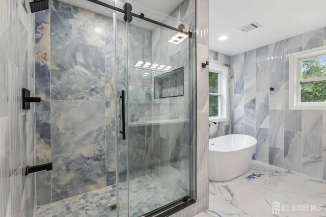 244 Lloyd Rd, Matawan, NJ 07747 - full bath featuring a freestanding bath, a marble finish shower, marble finish flooring, and tile walls