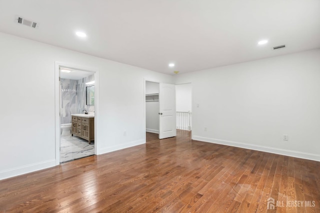 244 Lloyd Rd, Matawan, NJ 07747 - unfurnished bedroom with wood finished floors, baseboards, and recessed lighting