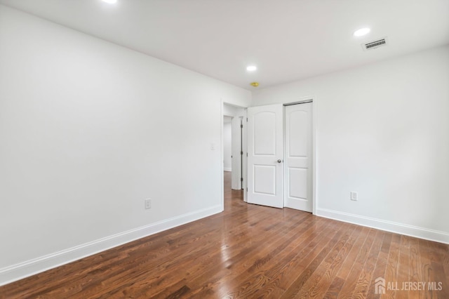 244 Lloyd Rd, Matawan, NJ 07747 - unfurnished bedroom with baseboards, wood finished floors, recessed lighting, and a closet