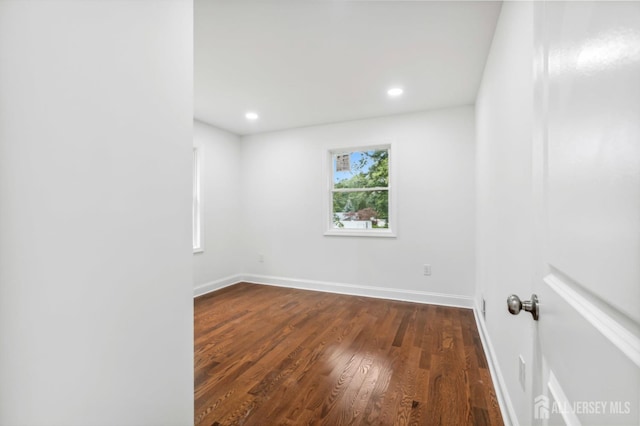 244 Lloyd Rd, Matawan, NJ 07747 - empty room with dark wood-style floors, baseboards, and recessed lighting