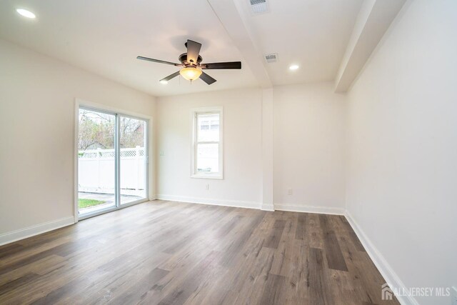 spare room with a ceiling fan, wood finished floors, baseboards, visible vents, and recessed lighting