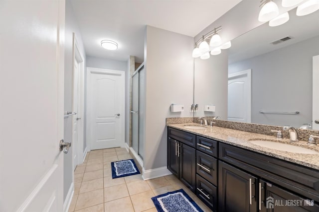 32 Cinder Rd Unit 22, Edison, NJ 08820 - bathroom with double vanity, tile patterned floors, and a stall shower