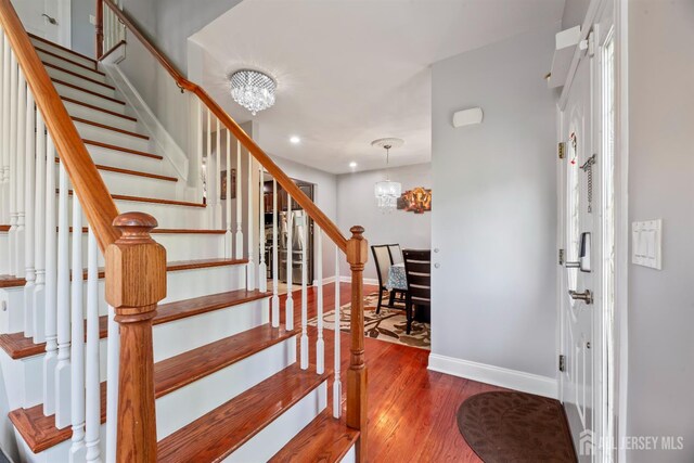 32 Cinder Rd Unit 22, Edison, NJ 08820 - stairs featuring a chandelier, wood finished floors, and recessed lighting