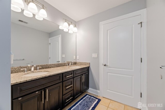 32 Cinder Rd Unit 22, Edison, NJ 08820 - bathroom with double vanity and tile patterned floors