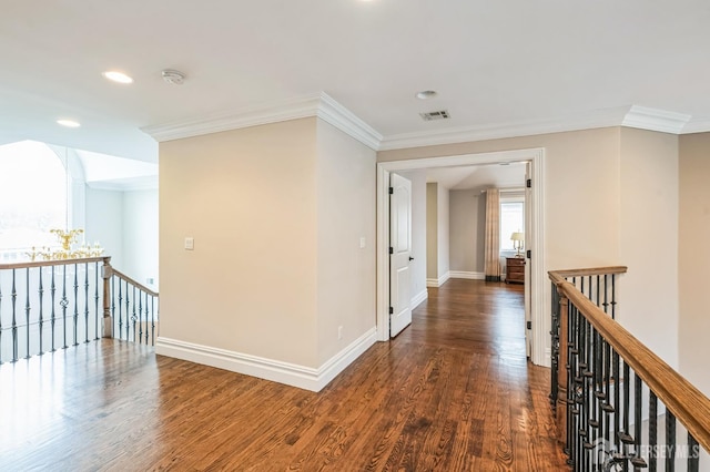 corridor featuring crown molding, an upstairs landing, and visible vents