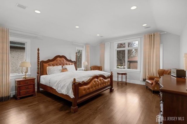 bedroom with visible vents, recessed lighting, baseboards, wood finished floors, and vaulted ceiling