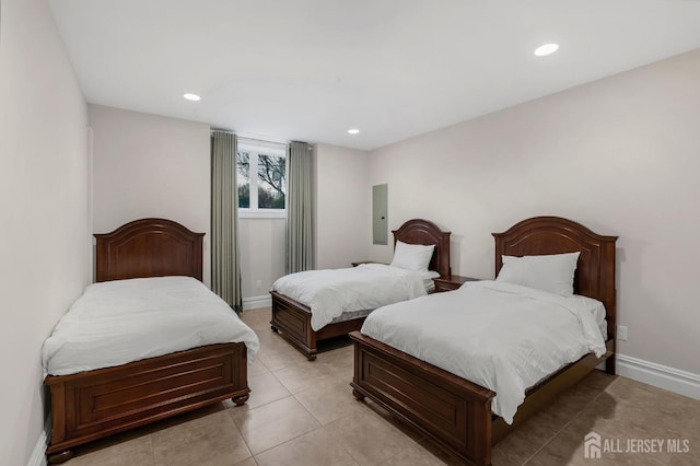 bedroom featuring light tile patterned floors, baseboards, and recessed lighting