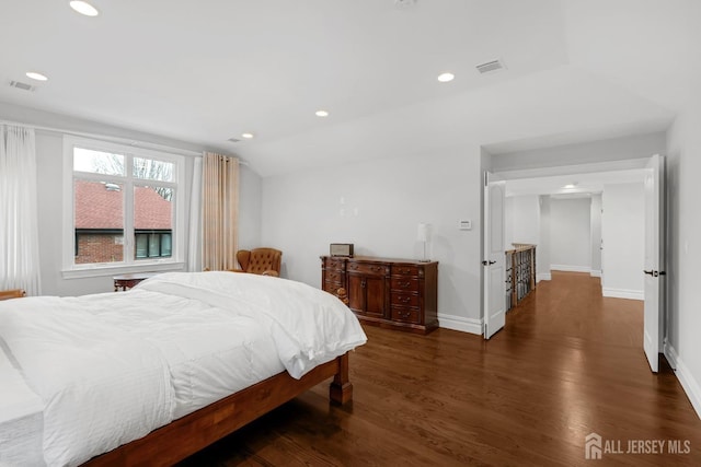 bedroom with visible vents, recessed lighting, baseboards, and wood finished floors