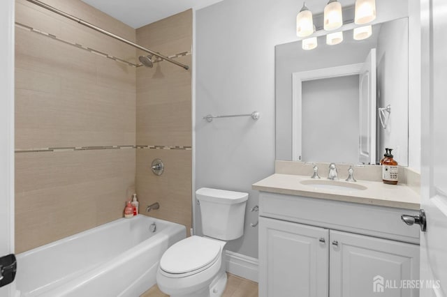 full bathroom featuring vanity, toilet, and bathtub / shower combination