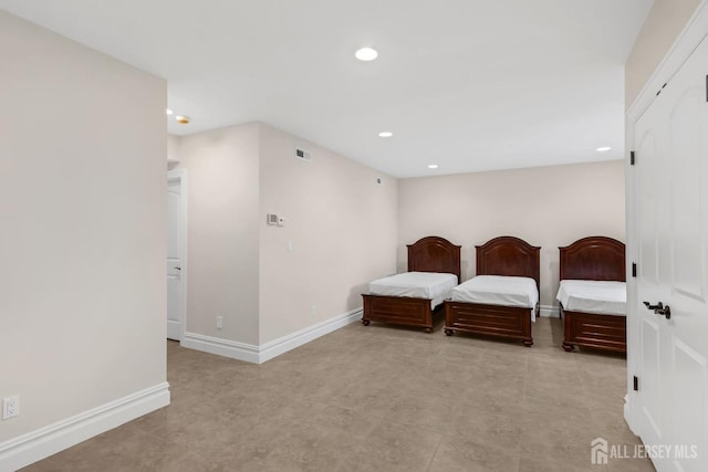 bedroom with baseboards, recessed lighting, and visible vents