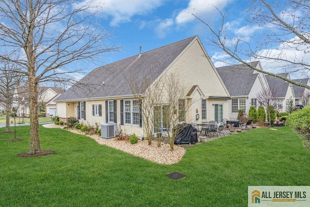 back of property featuring central AC, a lawn, and a patio area