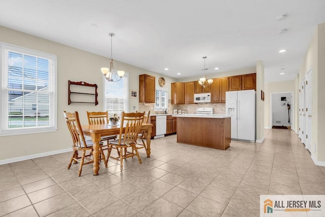 dining room featuring a chandelier, light tile patterned flooring, baseboards, and recessed lighting