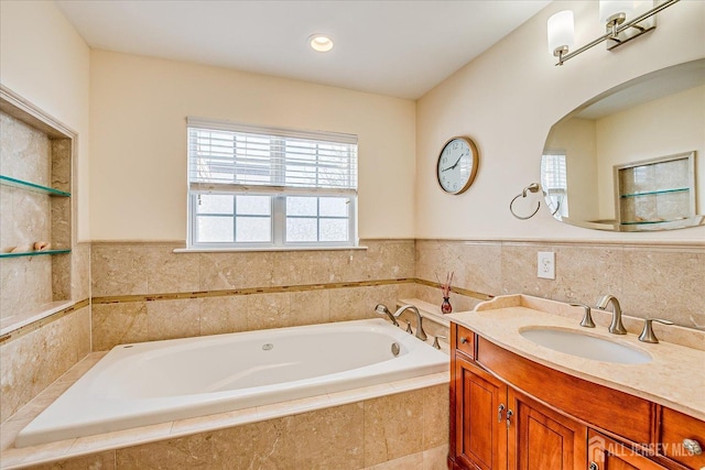 full bathroom with a bath and vanity