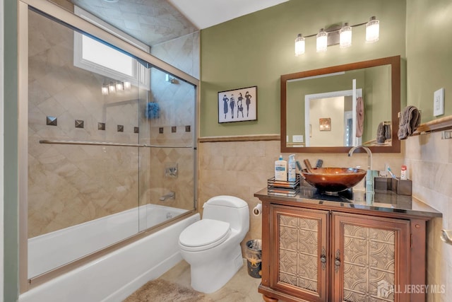 42 Ridge Rd, Edison, NJ 08817 - full bath featuring tile walls, toilet, shower / bath combination with glass door, and vanity