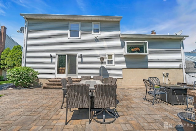 42 Ridge Rd, Edison, NJ 08817 - back of property featuring a patio area and outdoor dining space