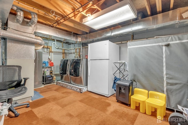 42 Ridge Rd, Edison, NJ 08817 - unfinished basement featuring freestanding refrigerator, independent washer and dryer, and water heater