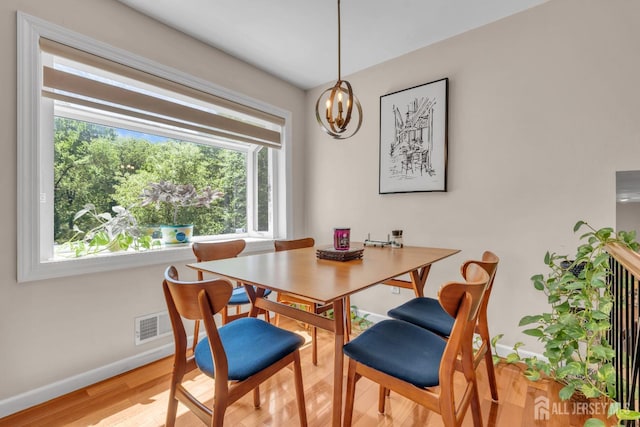 42 Ridge Rd, Edison, NJ 08817 - dining area featuring baseboards, light wood-style flooring, and a chandelier