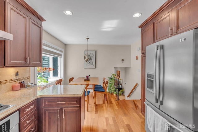 42 Ridge Rd, Edison, NJ 08817 - kitchen with stainless steel refrigerator with ice dispenser, light countertops, light wood-style floors, decorative backsplash, and recessed lighting