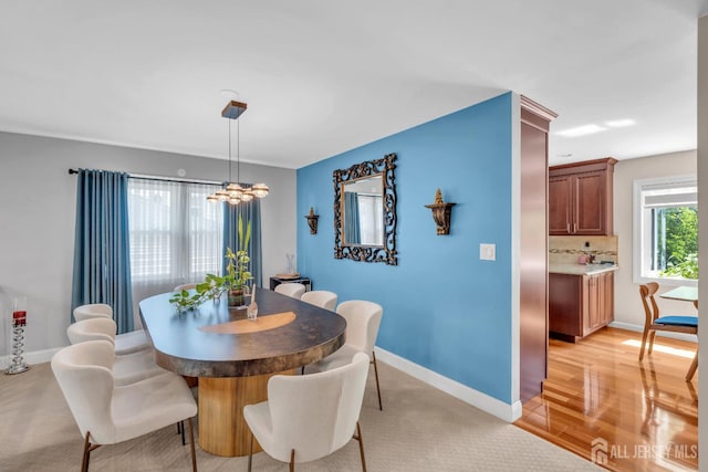 42 Ridge Rd, Edison, NJ 08817 - dining space featuring a chandelier, baseboards, and light wood-style flooring