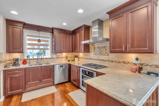 42 Ridge Rd, Edison, NJ 08817 - kitchen with appliances with stainless steel finishes, wall chimney range hood, a sink, light wood finished floors, and tasteful backsplash