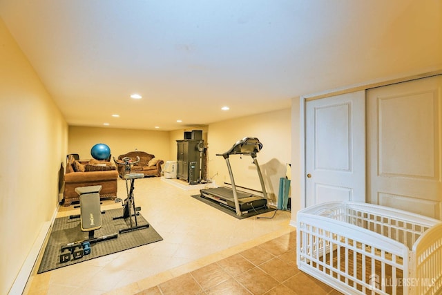 workout area with light tile patterned floors and recessed lighting