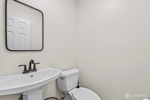 bathroom with sink and toilet