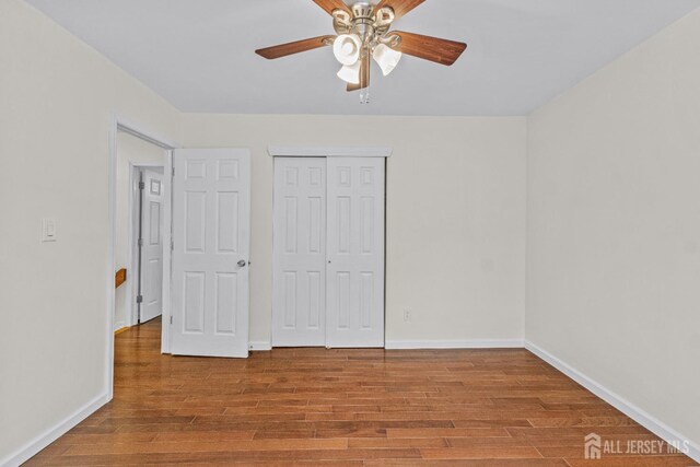 unfurnished bedroom with a closet, ceiling fan, and light hardwood / wood-style flooring