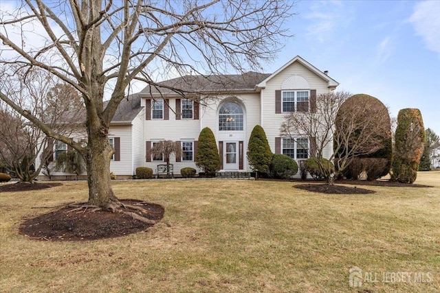 view of front of home with a front yard