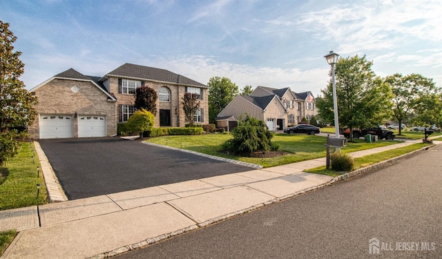 29 Mitchell Dr, Monroe, NJ 08831 - traditional-style home with an attached garage, a front yard, driveway, and a residential view