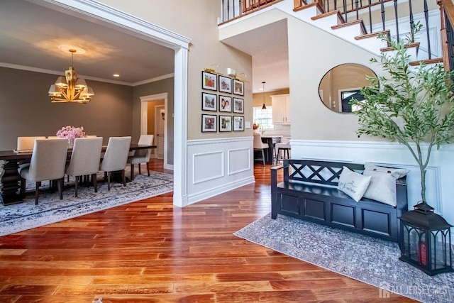 29 Mitchell Dr, Monroe, NJ 08831 - foyer with a chandelier, wood finished floors, crown molding, and a wainscoted wall