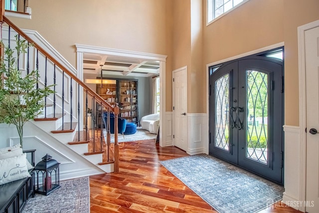 29 Mitchell Dr, Monroe, NJ 08831 - foyer featuring french doors, coffered ceiling, plenty of natural light, wood finished floors, and stairway
