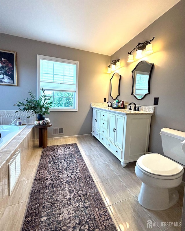 29 Mitchell Dr, Monroe, NJ 08831 - full bath with double vanity, a relaxing tiled tub, and tile patterned flooring