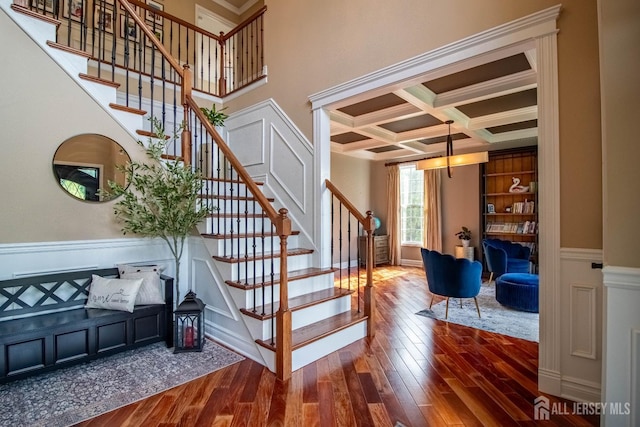 29 Mitchell Dr, Monroe, NJ 08831 - stairway featuring coffered ceiling, wood finished floors, beamed ceiling, crown molding, and a wainscoted wall