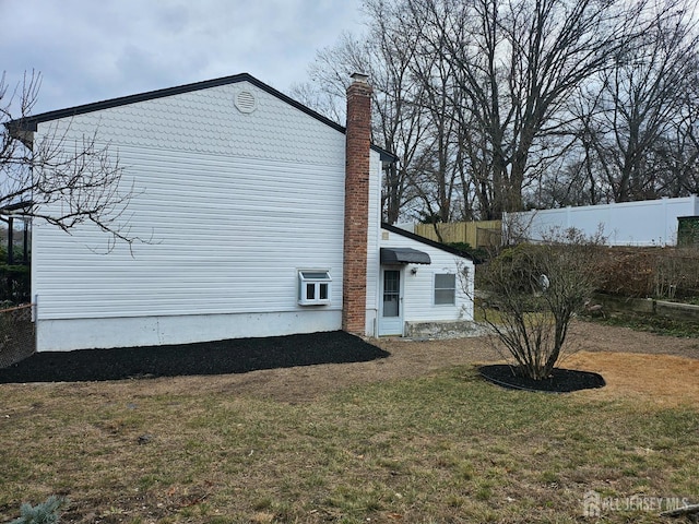 view of home's exterior featuring a yard