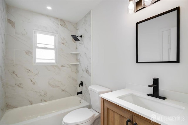 full bathroom with toilet, vanity, and tiled shower / bath