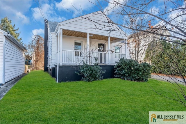 8 1st St, Sayreville, NJ 08872 - view of front of house with covered porch and a front lawn