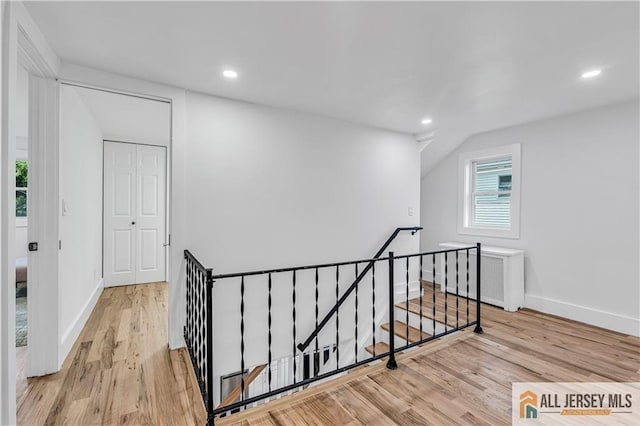 8 1st St, Sayreville, NJ 08872 - hall with an upstairs landing, wood finished floors, baseboards, and recessed lighting