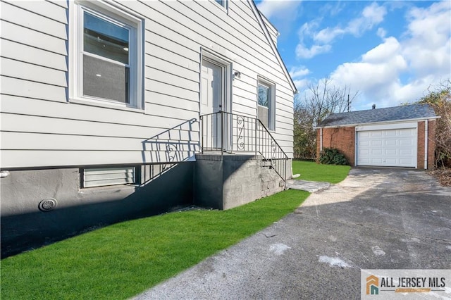 8 1st St, Sayreville, NJ 08872 - view of side of property featuring driveway, an outbuilding, and a garage
