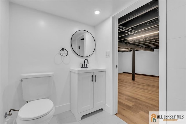 8 1st St, Sayreville, NJ 08872 - bathroom featuring toilet, vanity, baseboards, recessed lighting, and tile patterned flooring