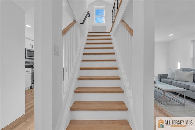 8 1st St, Sayreville, NJ 08872 - staircase featuring wood finished floors and recessed lighting